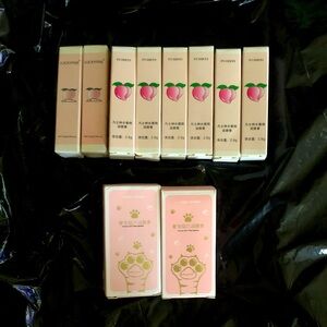 Ten peach-colored lip balms